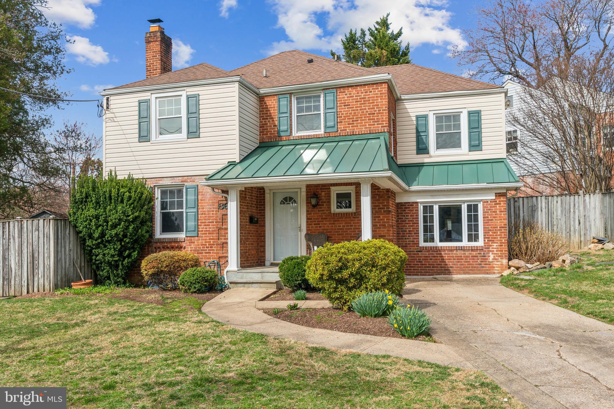 8601 Sundale Drive Silver Spring, MD 20910 - Photo 1 of 1 a front view of a house with garden