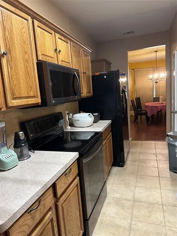 a kitchen with a sink and a refrigerator