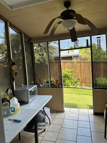 a dining room with a table and chairs