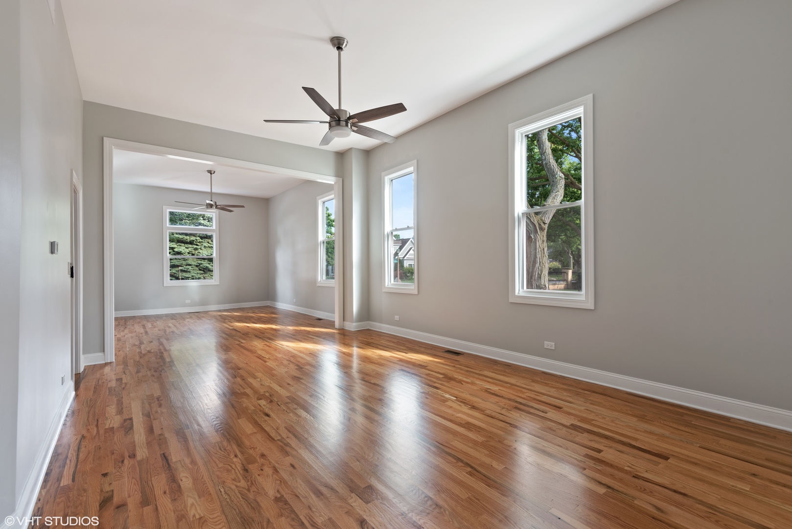 1131 Ridge Road, Unit 1 Wilmette, IL 60091 - Photo 4 of 14 a view of an empty room with wooden floor and a window