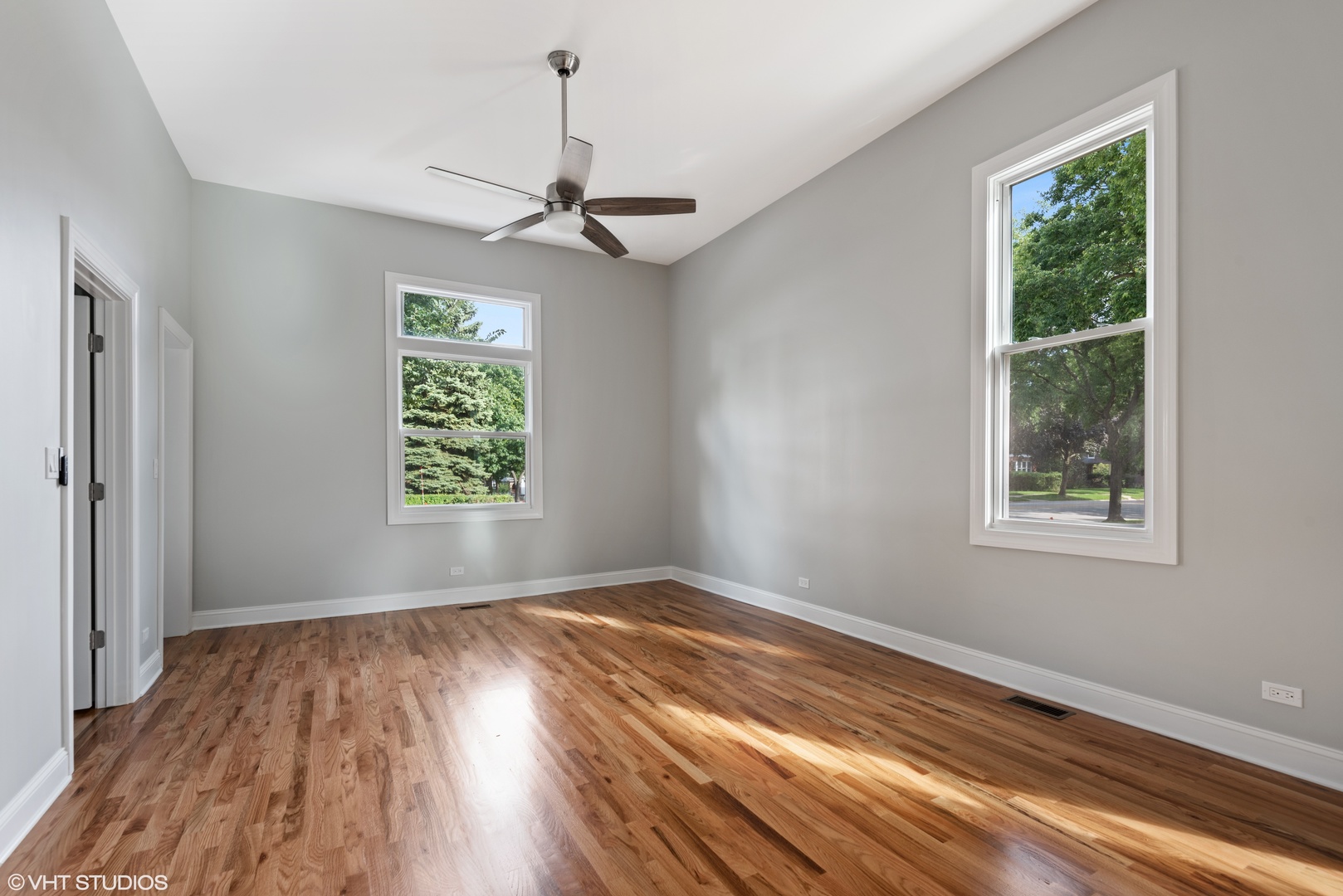 1131 Ridge Road, Unit 1 Wilmette, IL 60091 - Photo 5 of 14 wooden floor in an empty room with a window
