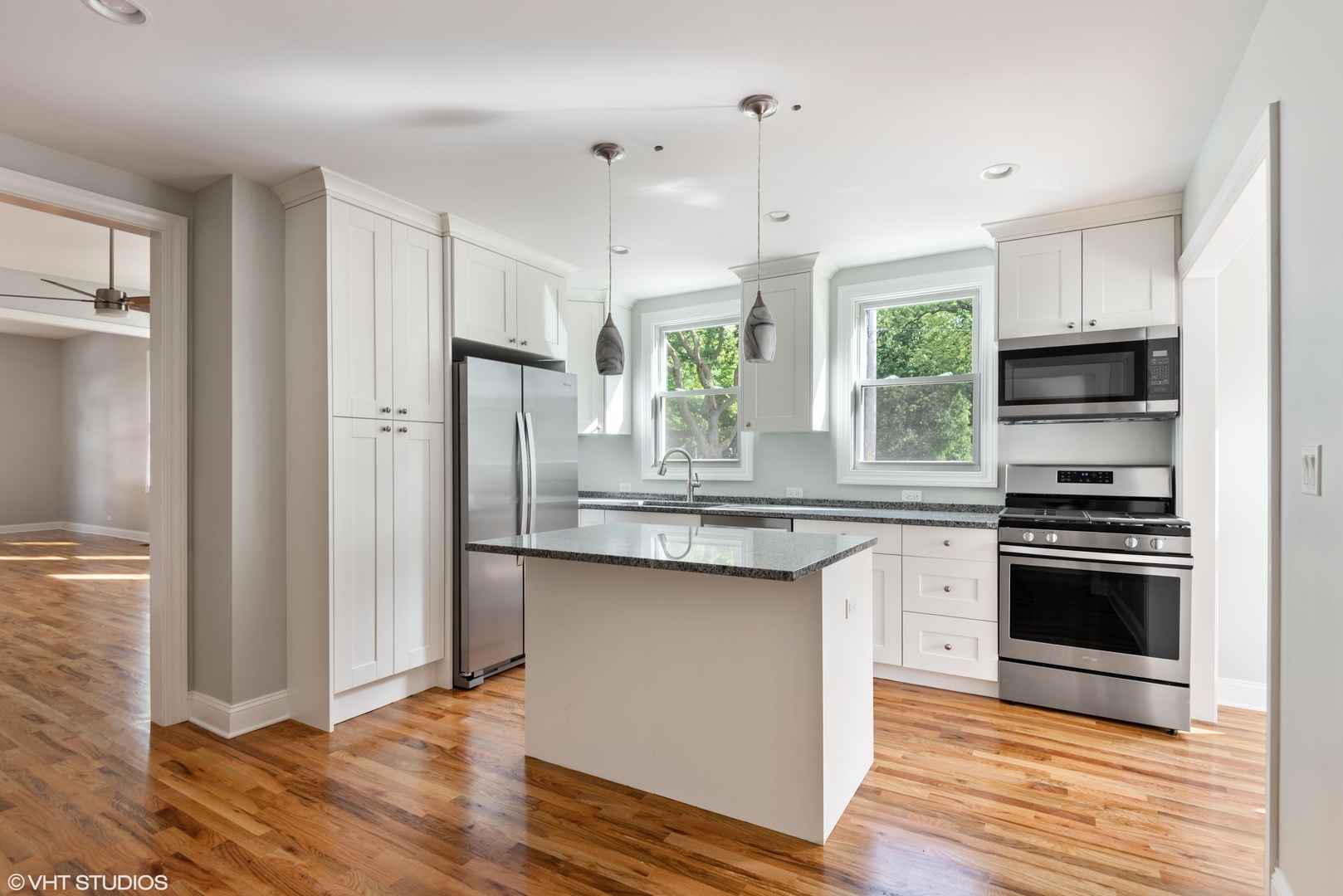 1131 Ridge Road, Unit 1 Wilmette, IL 60091 - Photo 6 of 14 a kitchen with stainless steel appliances granite countertop a stove a refrigerator and a sink