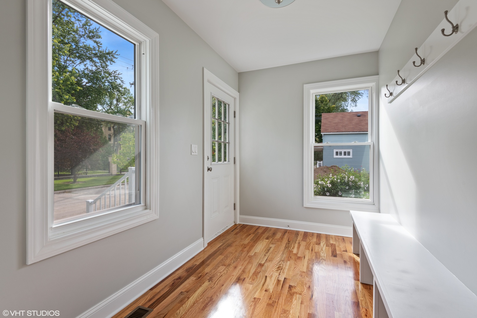 1131 Ridge Road, Unit 1 Wilmette, IL 60091 - Photo 8 of 14 a view of an empty room with wooden floor and a window