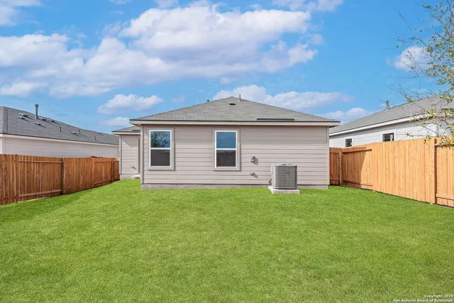 a front view of a house with yard