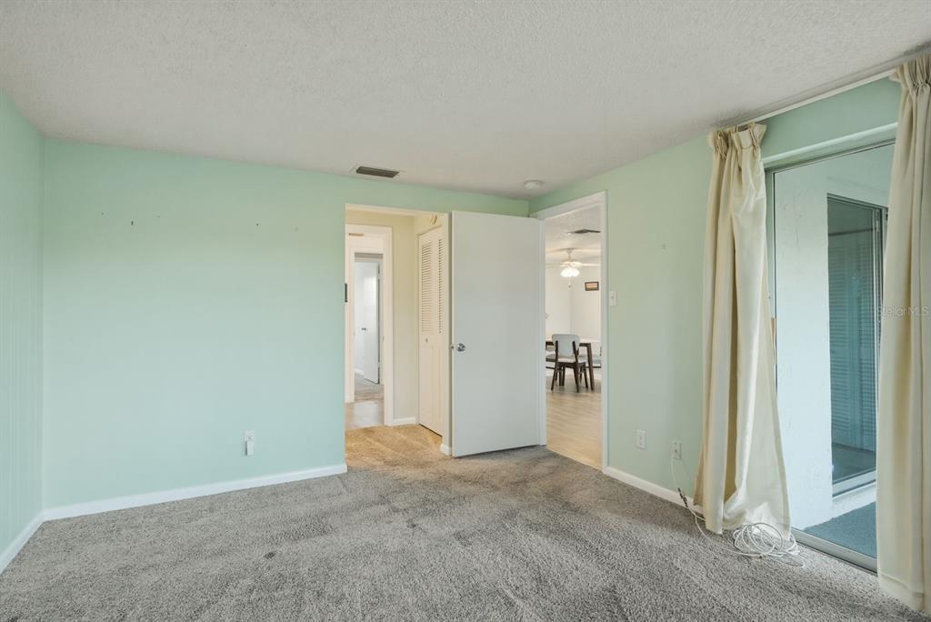 3309 Trophy Boulevard New Port Richey, FL 34655 - Photo 13 of 37 an empty room with closet and a hallway