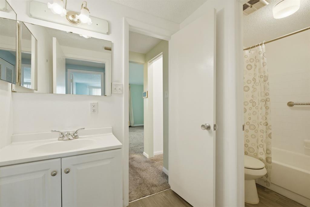 3309 Trophy Boulevard New Port Richey, FL 34655 - Photo 16 of 37 a bathroom with a sink a toilet and shower