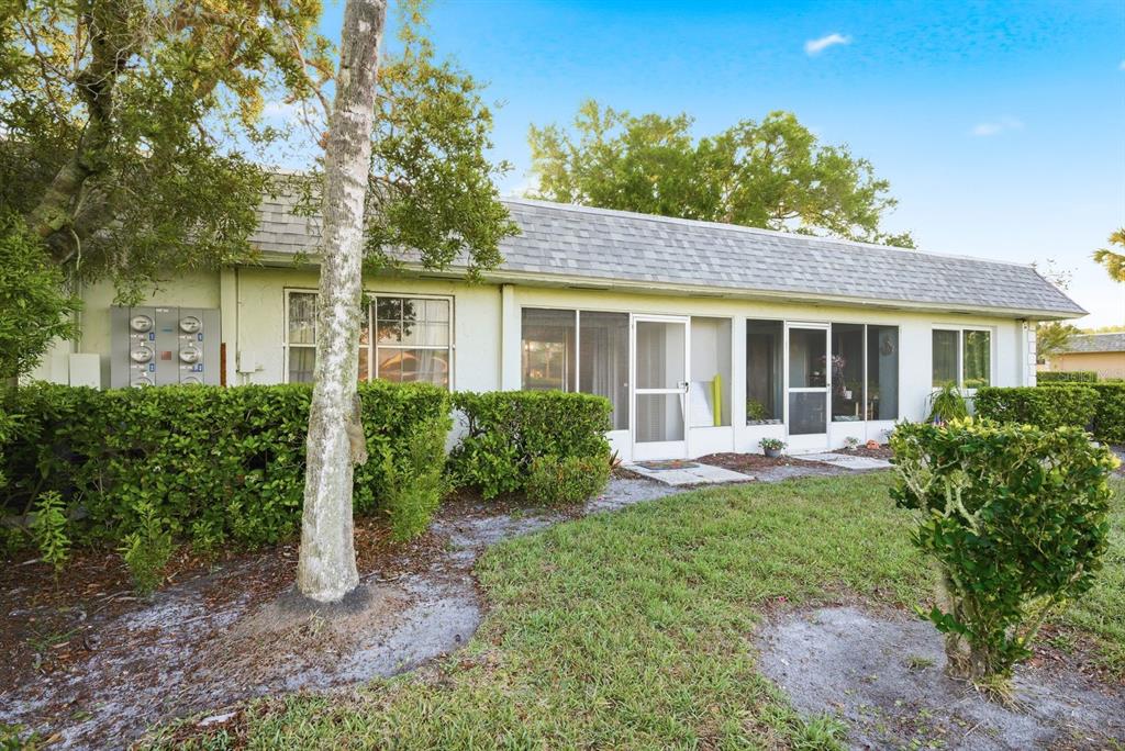 3309 Trophy Boulevard New Port Richey, FL 34655 - Photo 24 of 37 a front view of a house with a yard and porch