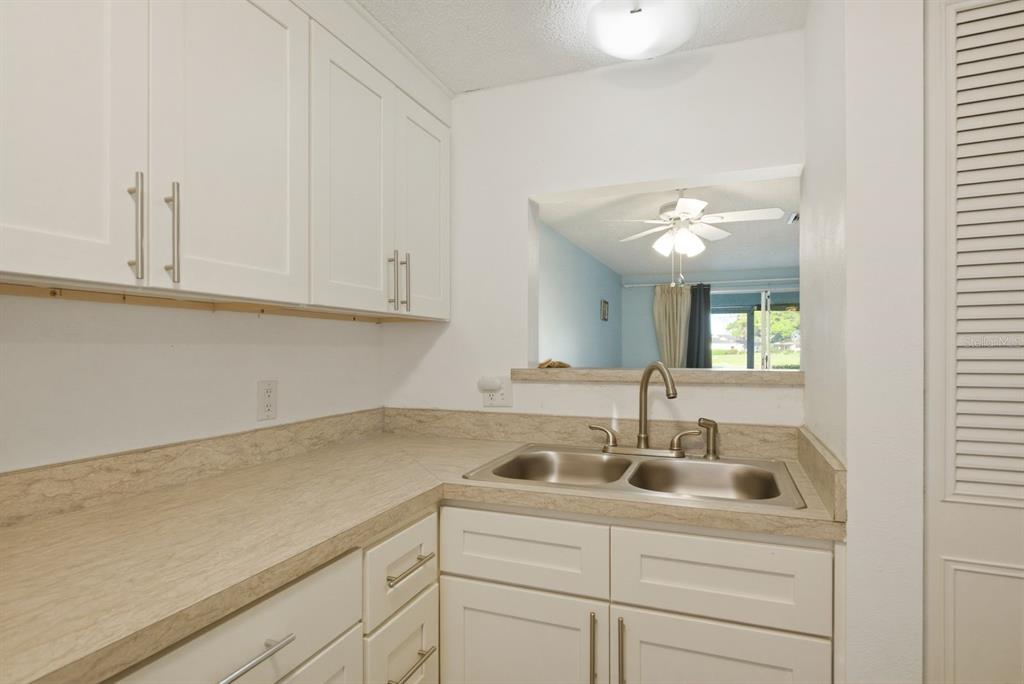 3309 Trophy Boulevard New Port Richey, FL 34655 - Photo 5 of 37 a kitchen with a sink cabinets and window