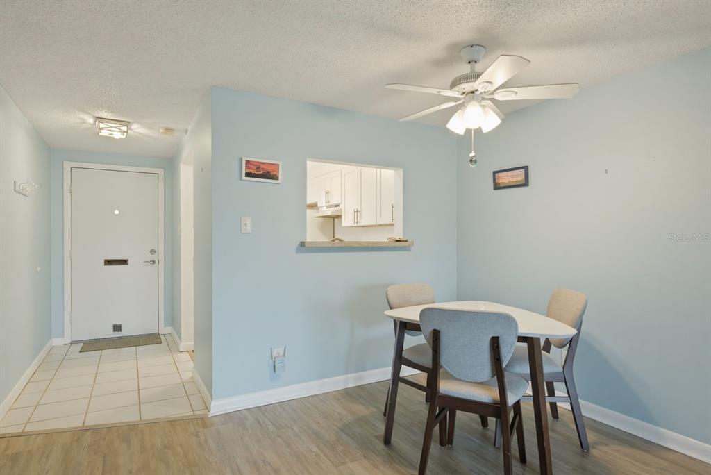 3309 Trophy Boulevard New Port Richey, FL 34655 - Photo 10 of 37 a view of a dining room with a table and chairs