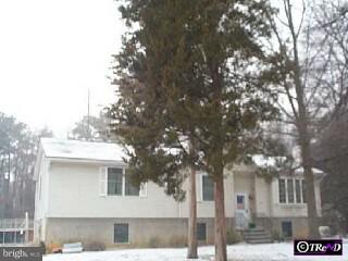 32 Maple Road Pittsgrove, NJ 08318 - Photo 1 of 1 a front view of a house with a tree