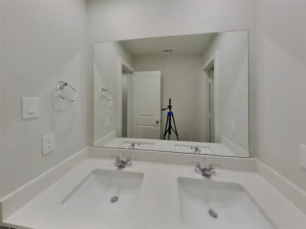 a view of an house with backyard space and balcony