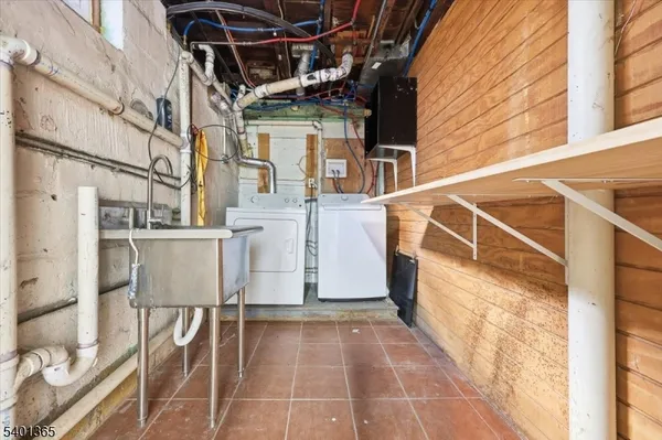a view of a patio with table and chairs and stairs