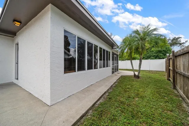 a view of house with backyard