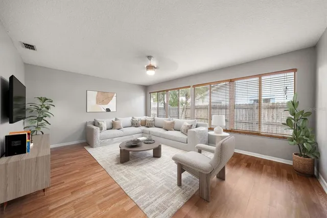 a living room with furniture and a large window