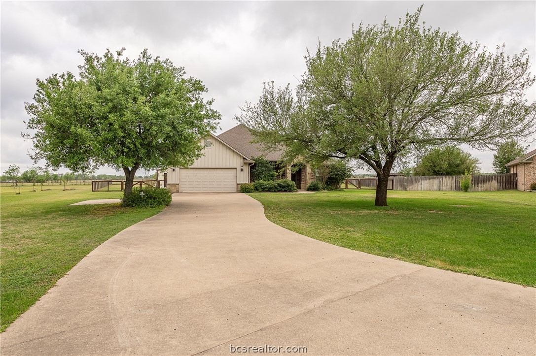 4192 WAGONWHEEL Road Bryan, TX 77808 - Photo 2 of 41 Obstructed view of property with driveway and a garage
