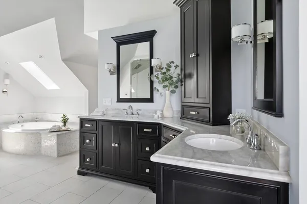 a spacious bathroom with a double vanity sink and a mirror
