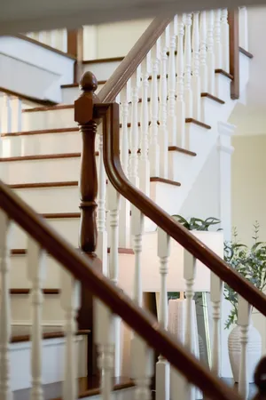 a view of entryway with wooden floor and stairs