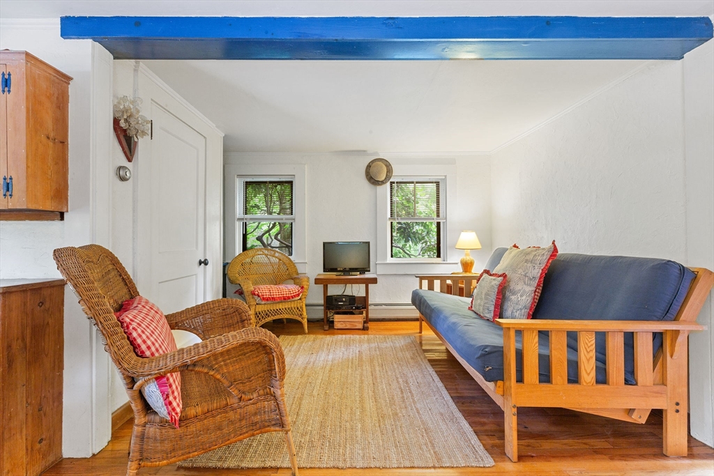 614 Tubman Road Brewster, MA 02631 - Photo 14 of 26 a living room with furniture and a table