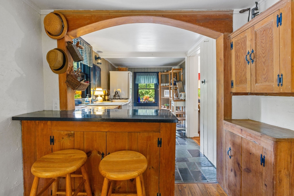 614 Tubman Road Brewster, MA 02631 - Photo 16 of 26 a kitchen with a sink and a refrigerator