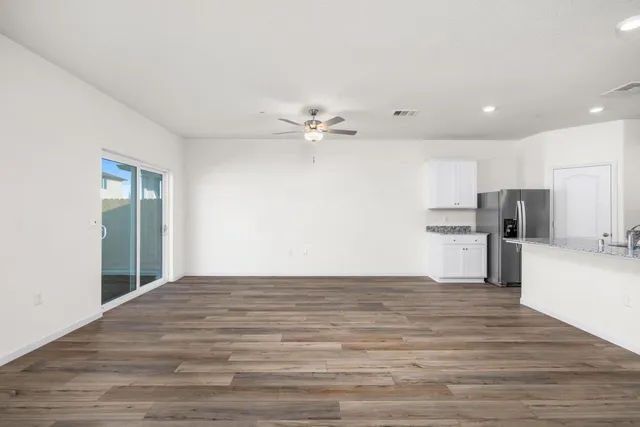 a view of a kitchen with wooden floor