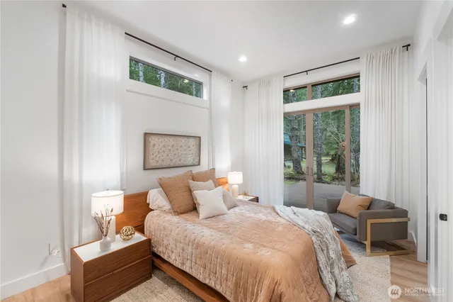 a bedroom with bed and a window