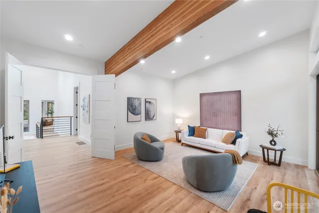 a bedroom with furniture and a wooden floor