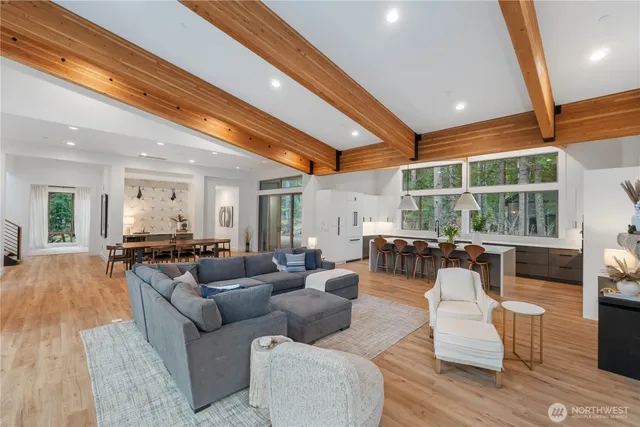 a living room with furniture and garden view