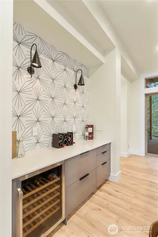 a kitchen with a sink a stove and cabinets