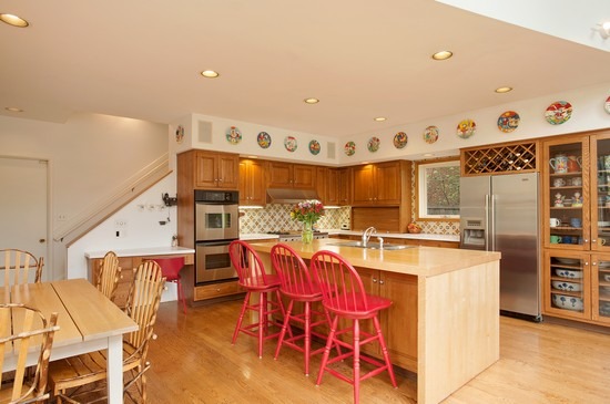 131 Apple Tree Road Winnetka, IL 60093 - Photo 5 of 14 a kitchen with stainless steel appliances kitchen island granite countertop a table and chairs