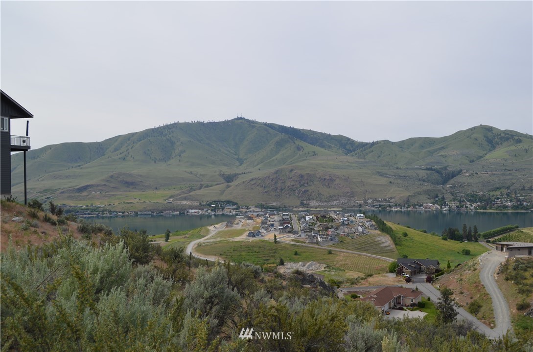 111 Crest Drive Chelan, WA 98816 - Photo 3 of 9 a view of a lake with mountains in the background
