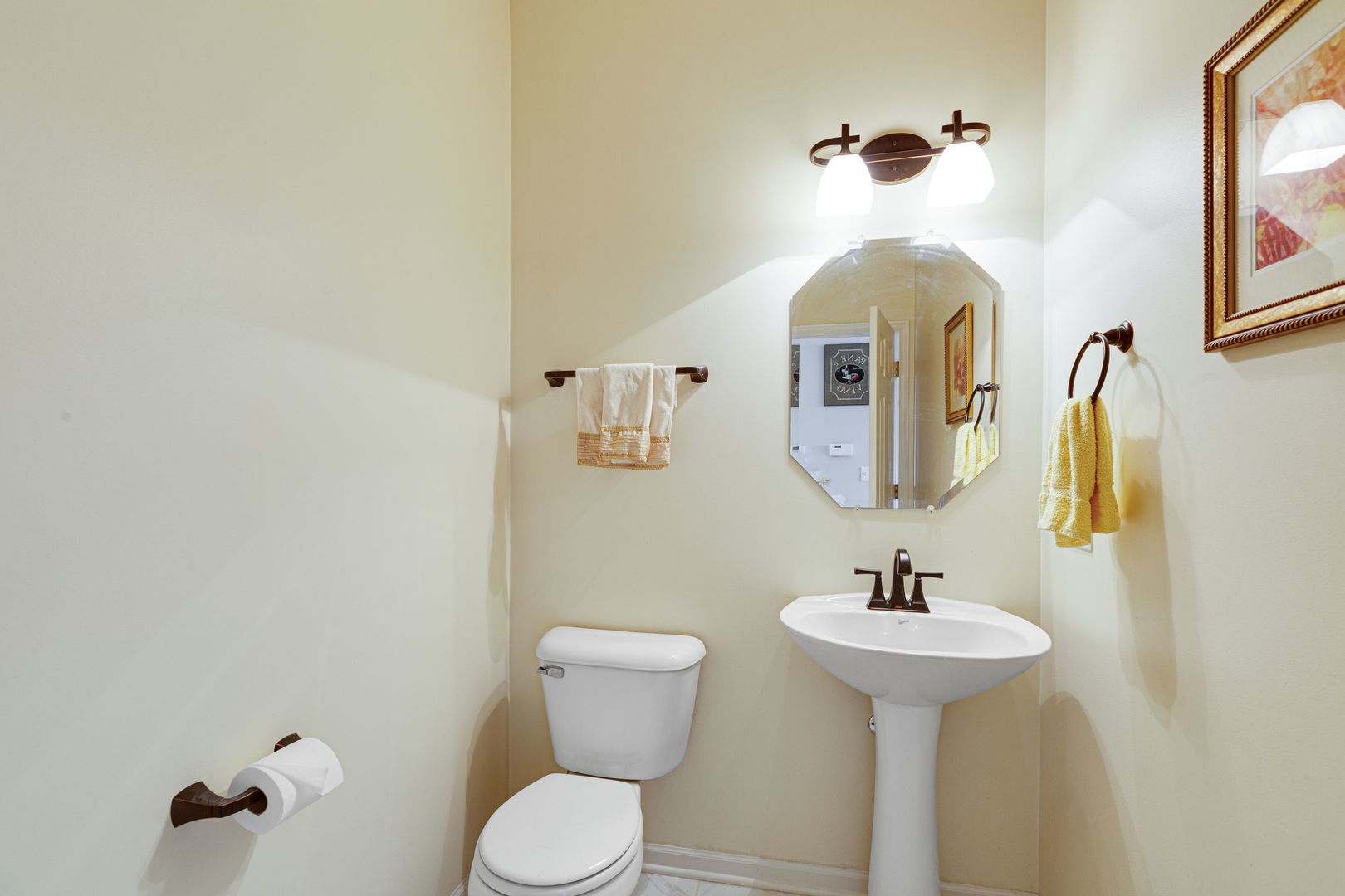 674 Lambert Lane Bartlett, IL 60103 - Photo 11 of 22 a bathroom with a toilet sink and mirror