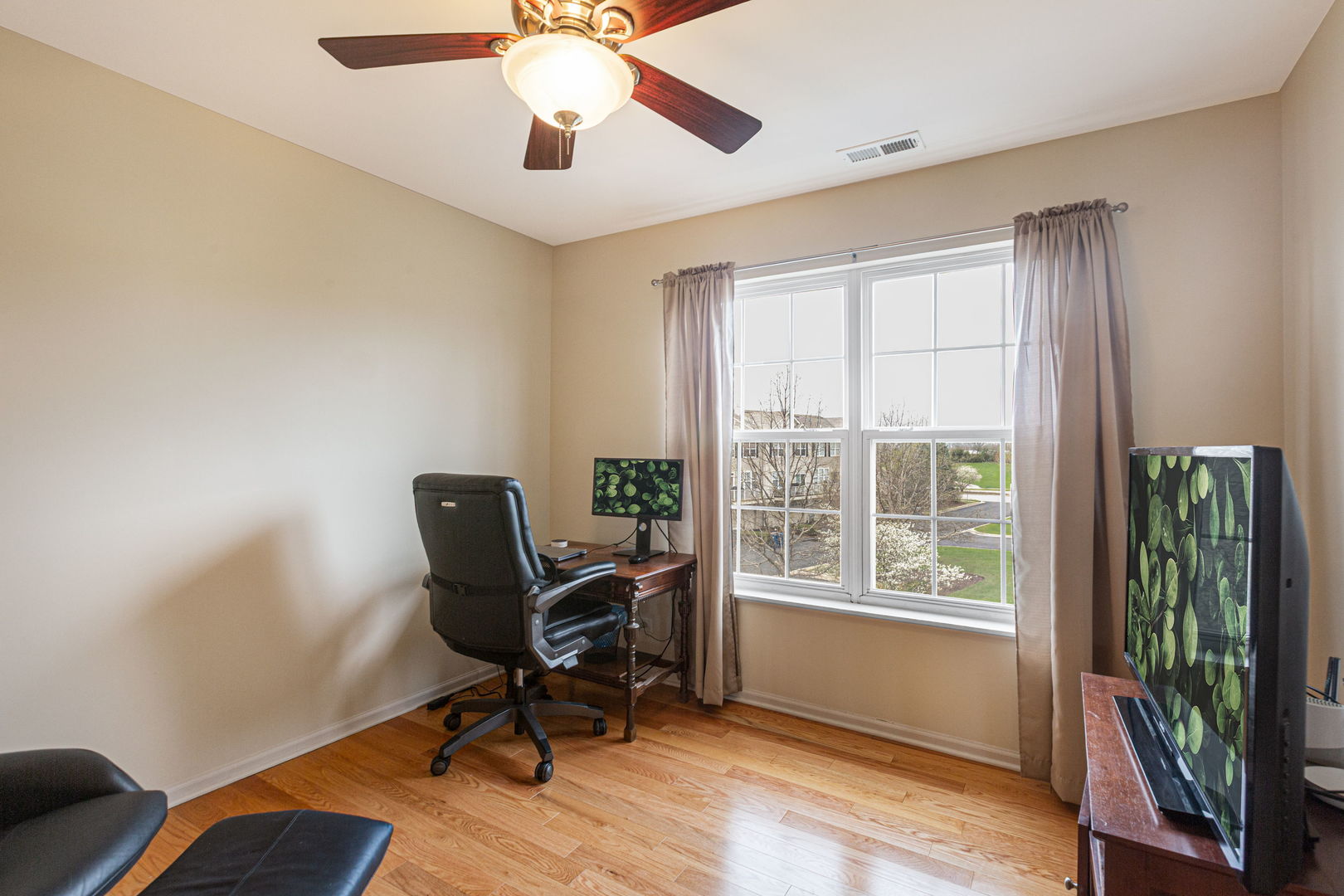 674 Lambert Lane Bartlett, IL 60103 - Photo 12 of 22 a view of a workspace with furniture and a window