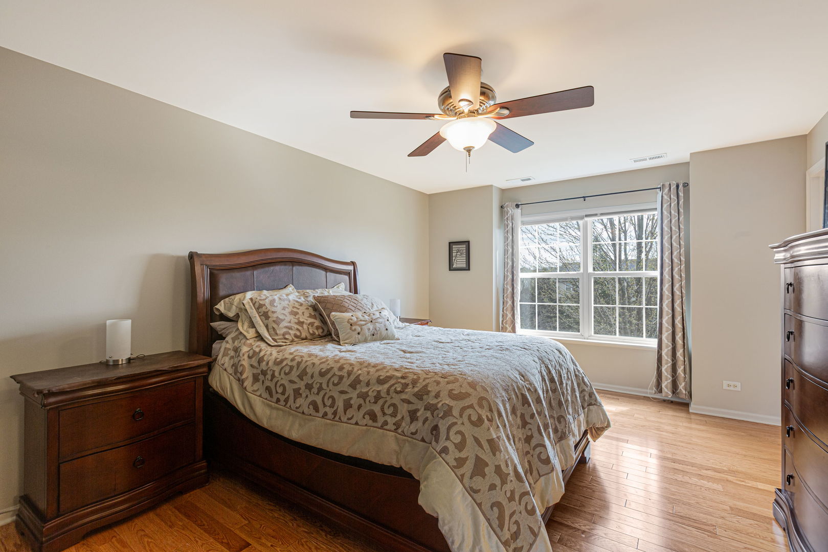 674 Lambert Lane Bartlett, IL 60103 - Photo 13 of 22 a bedroom with a large bed and a window
