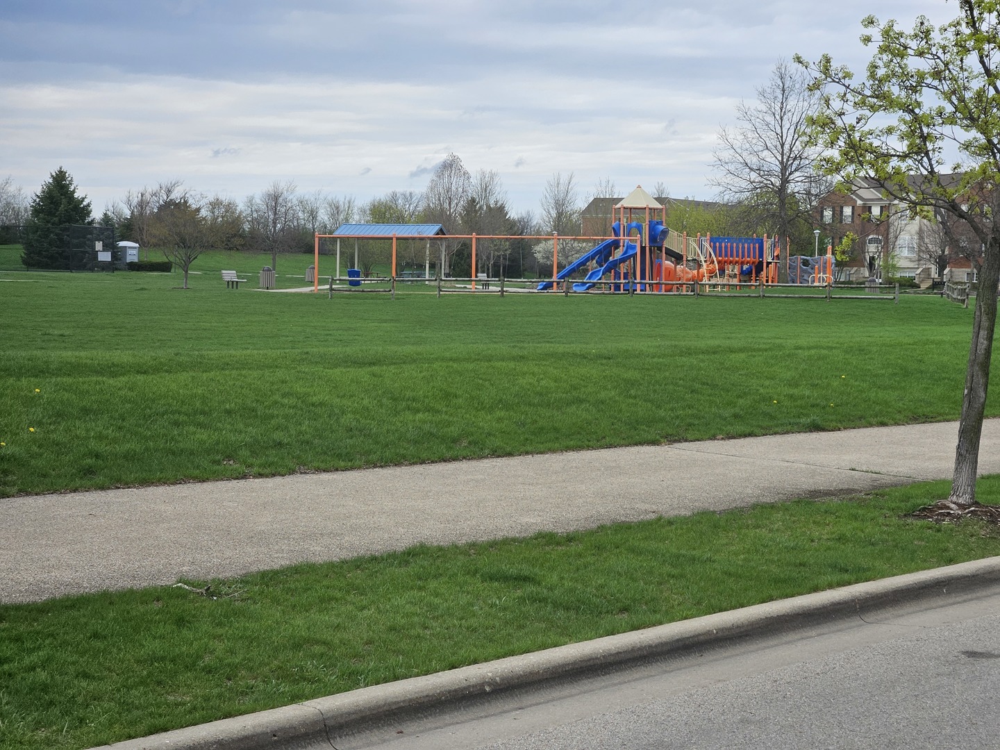674 Lambert Lane Bartlett, IL 60103 - Photo 21 of 22 a view of building with play ground and trees all around