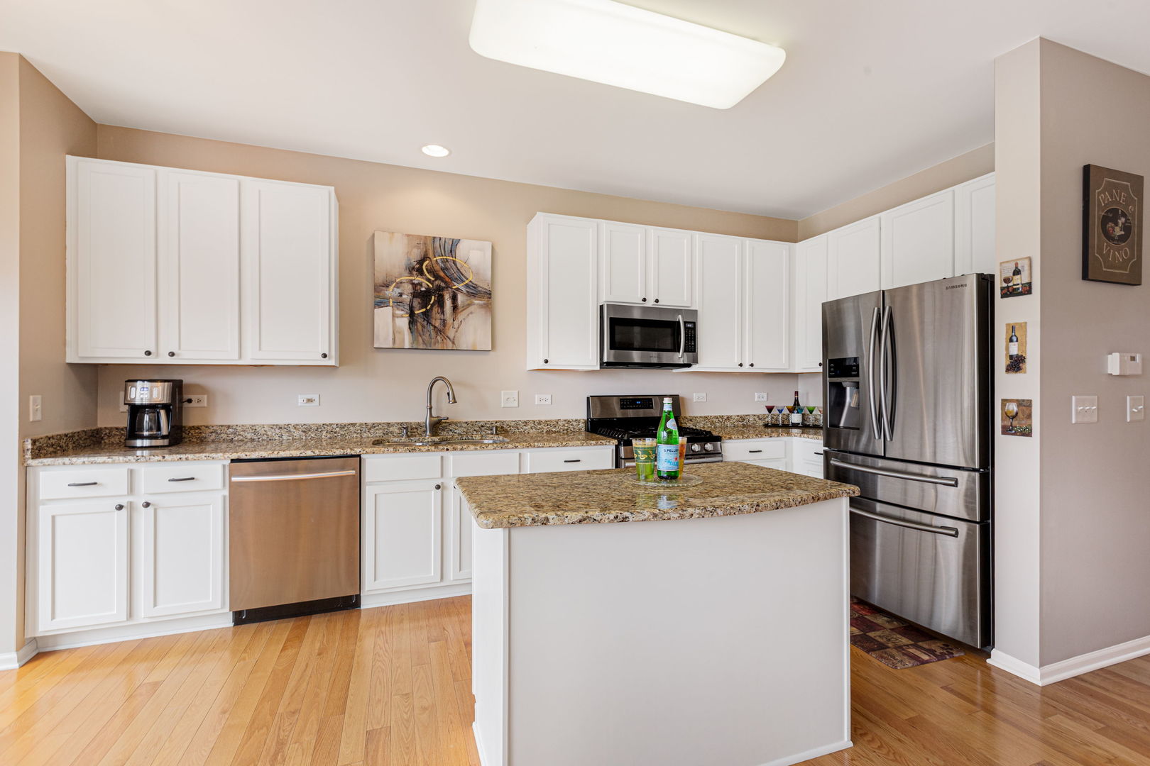 674 Lambert Lane Bartlett, IL 60103 - Photo 7 of 22 a kitchen with stainless steel appliances granite countertop a refrigerator a stove top oven a sink and dishwasher