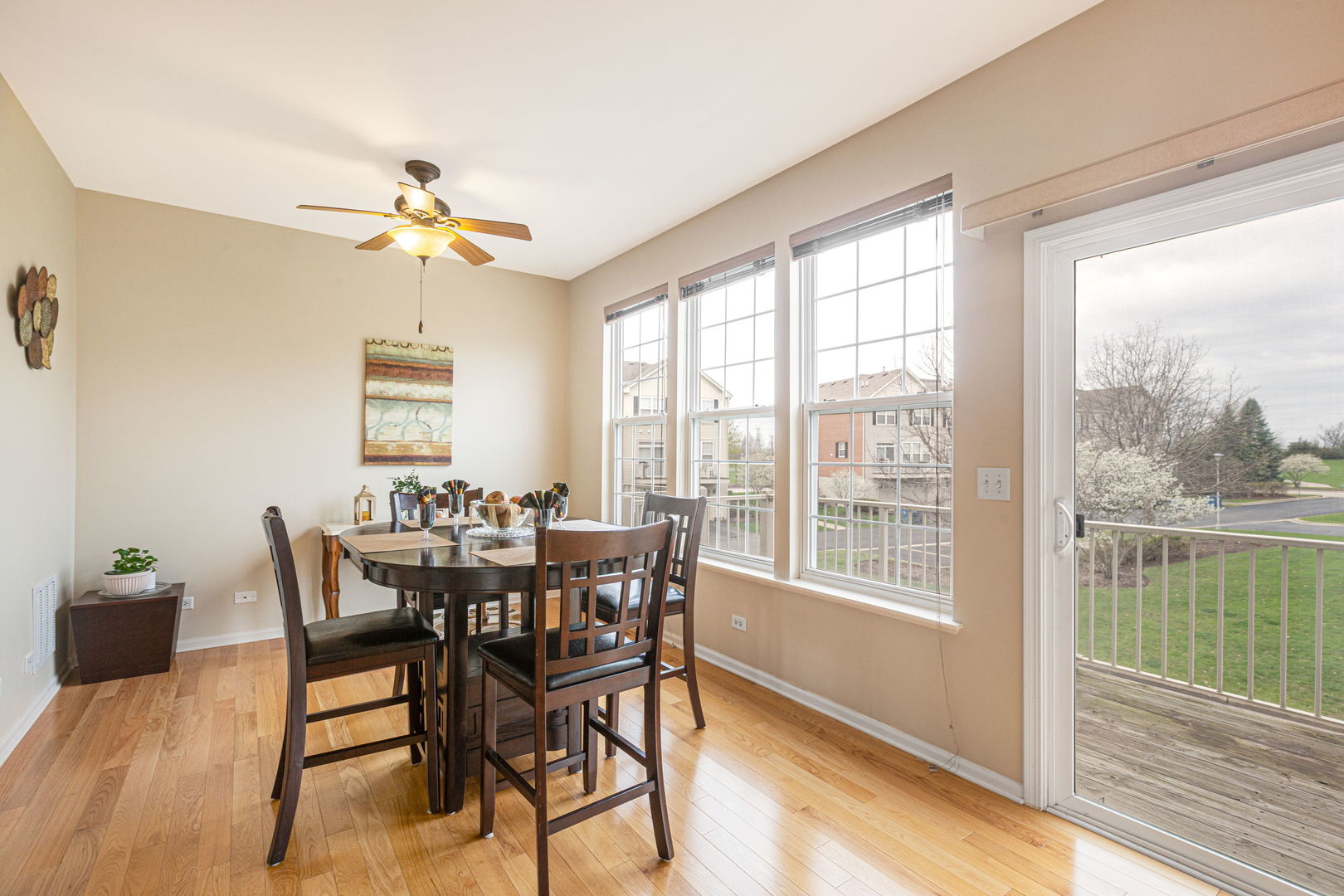 674 Lambert Lane Bartlett, IL 60103 - Photo 8 of 22 a view of a dining room with furniture window and wooden floor