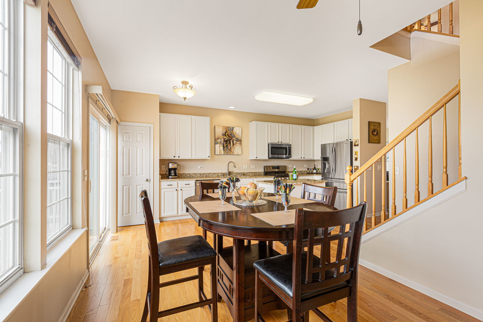 674 Lambert Lane Bartlett, IL 60103 - Photo 9 of 22 a view of a dining room with furniture and a table