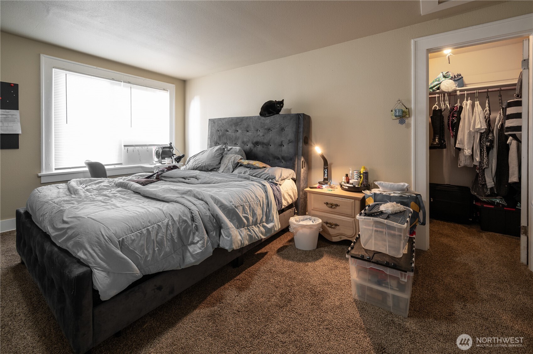 409 North M Street Aberdeen, WA 98520 - Photo 14 of 20 a bedroom with a bed and wooden floor