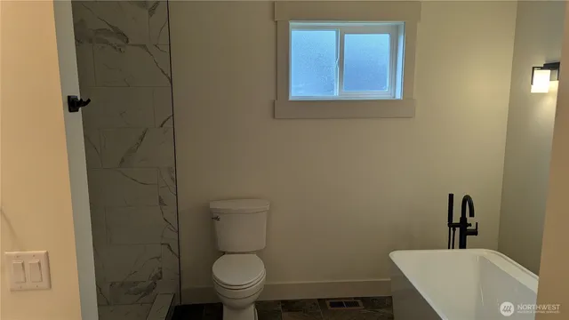 a bathroom with a sink and toilet