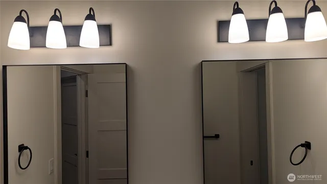 a bathroom with a sink and mirror