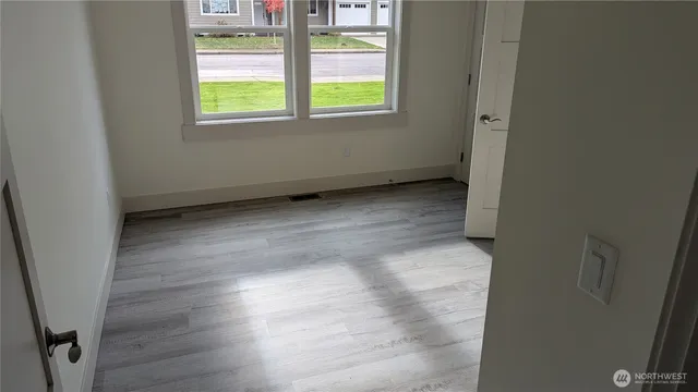 a view of an empty room with a window