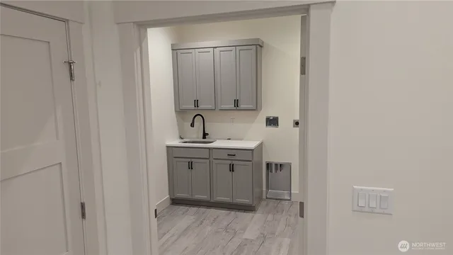 a bathroom with a sink and a mirror