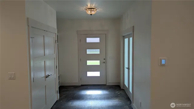 a view of empty room with windows