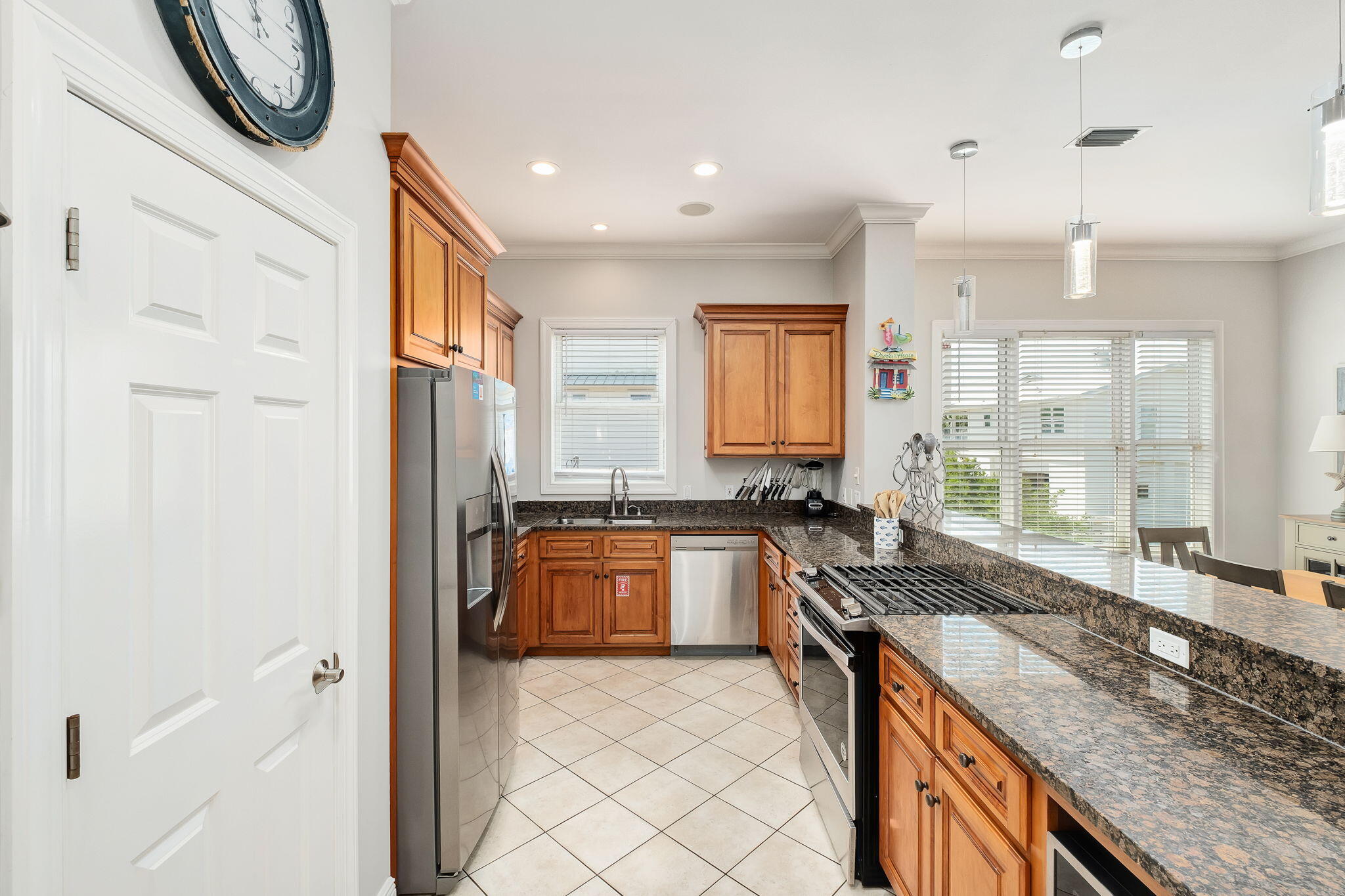 226 Sandtrap Road Miramar Beach, FL 32550 - Photo 11 of 15 a large kitchen with granite countertop a sink and a stove