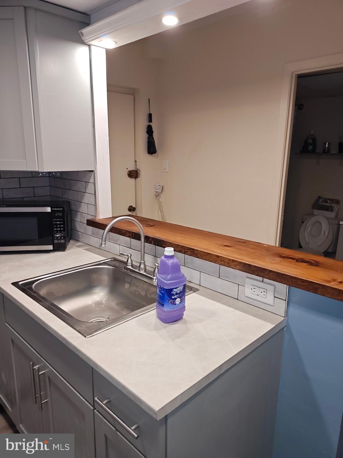 1575 West Street Road, Unit 818 Warminster, PA 18974 - Photo 16 of 24 a kitchen with a sink and a refrigerator