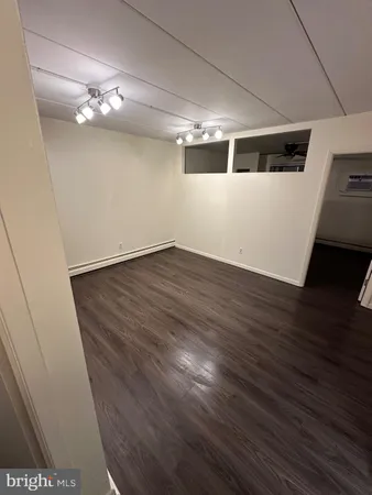 a view of a livingroom with wooden floor