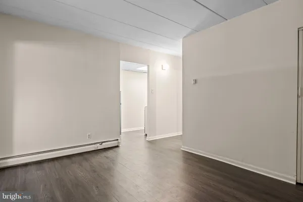 an empty room with wooden floor