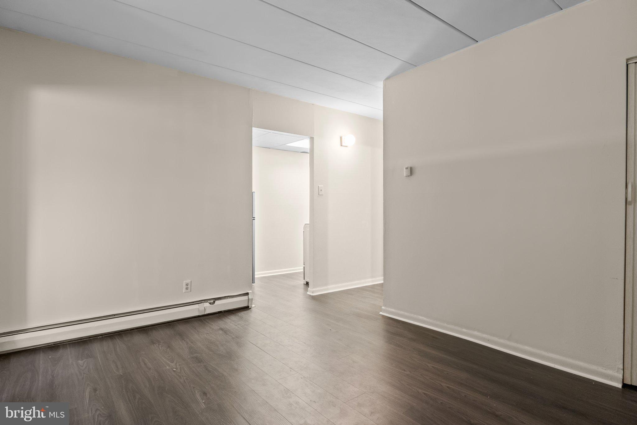 1575 West Street Road, Unit 818 Warminster, PA 18974 - Photo 10 of 24 an empty room with wooden floor