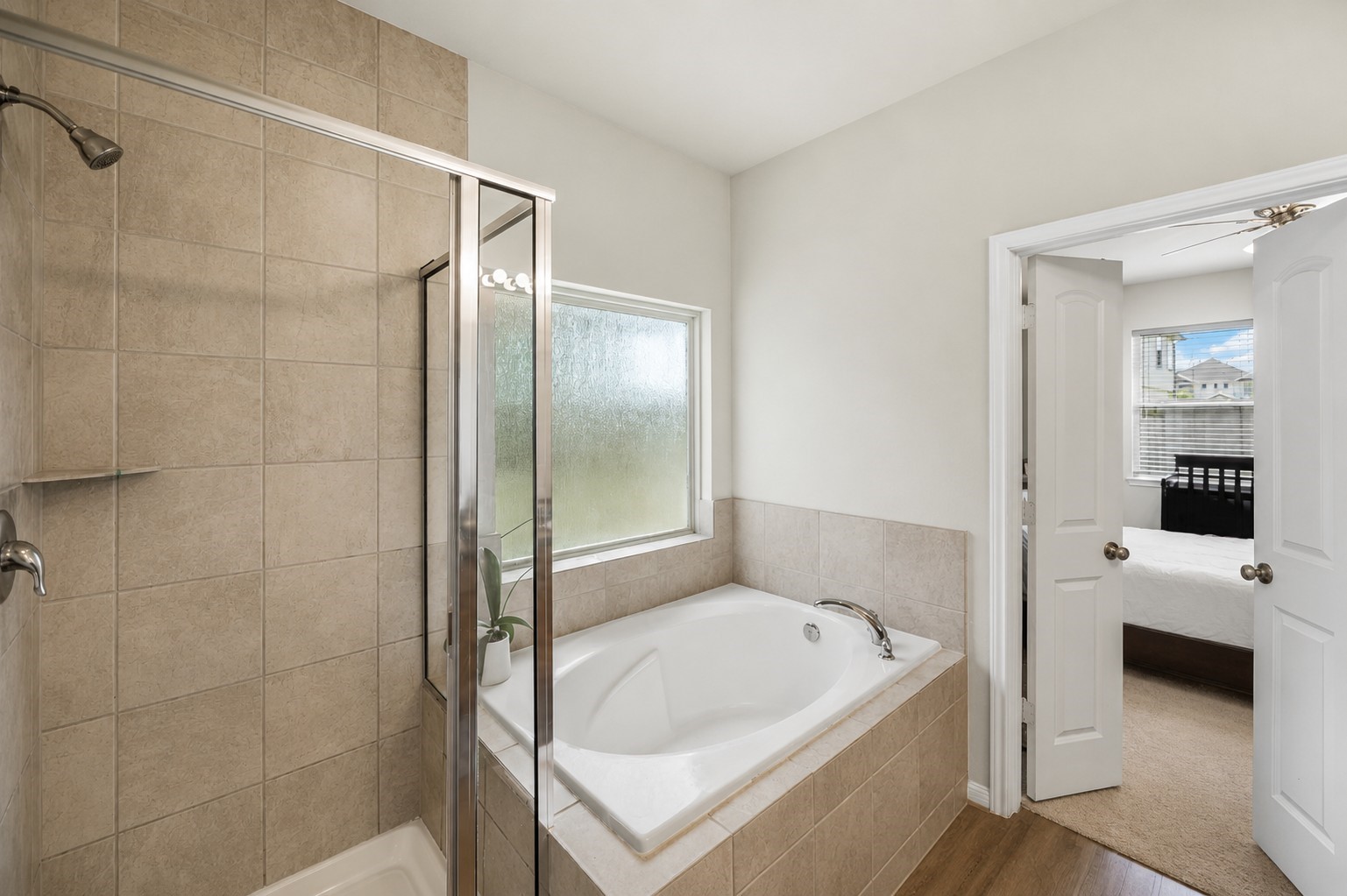 10423 Rochester Hls Lane Tomball, TX 77375 - Photo 20 of 36 Indulge in the ultimate comfort within this beautifully appointed primary en-suite bathroom.