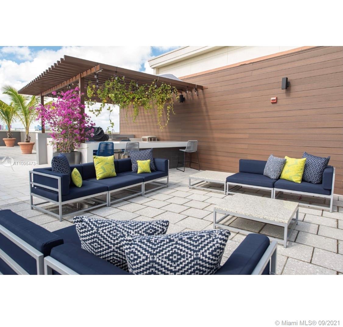 Midtown Miami Miami, FL 33127 - Photo 22 of 26 a view of outdoor seating space with patio furniture